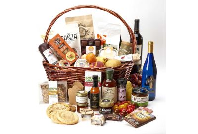 "A beautifully arranged gourmet gift basket featuring a bottle of red wine, assorted cheeses, crackers, and chocolates