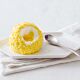 Bindi Tartufo Limoncello individual desserts, spherical lemon-flavored treats with a soft, creamy center, coated in a smooth lemon-infused shell, and served in elegant dessert cups, perfect for a refreshing citrus indulgence.