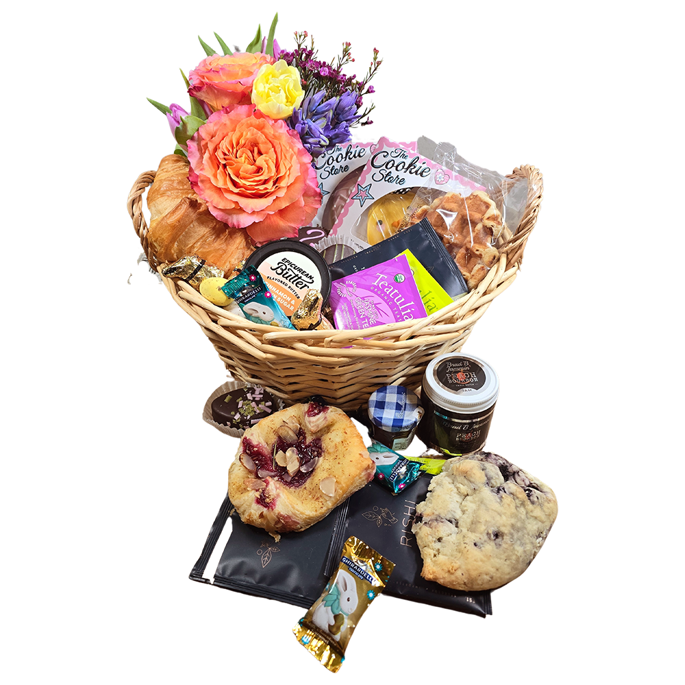 Easter Breakfast Pastry sweets basket with Flowers, Tea and Honey